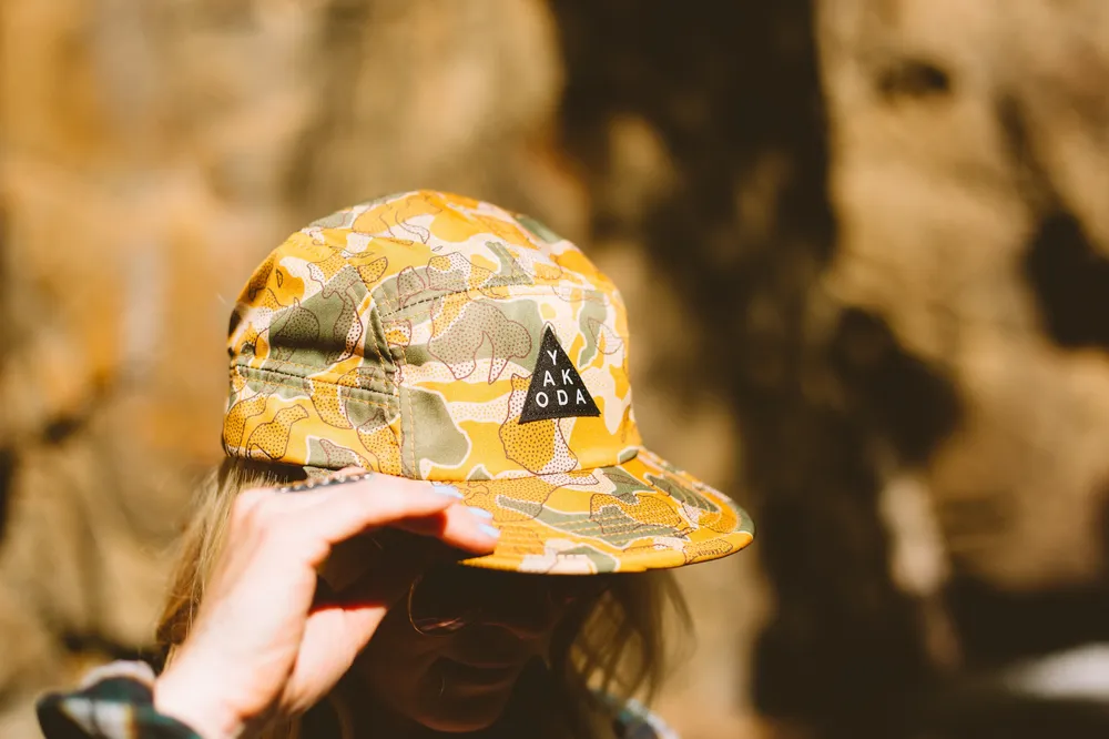 Yakoda Supply Desert Camo Sublimated Interior Woven Label Screen Printed Seam Covers Woven Clamp Tag Custom Running Cap Hat by Anthem Branding